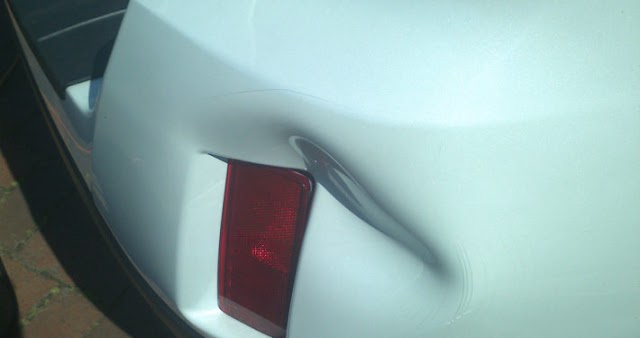 Carsmetic Paintless Dent Repair Door Ding Removal photo 1